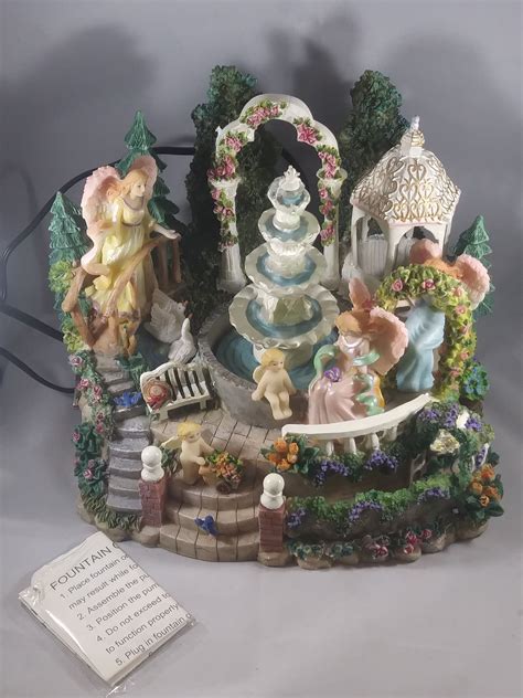 This specific one has some wolves and bears on multi-level rocks. . Classic treasures musical water fountain
